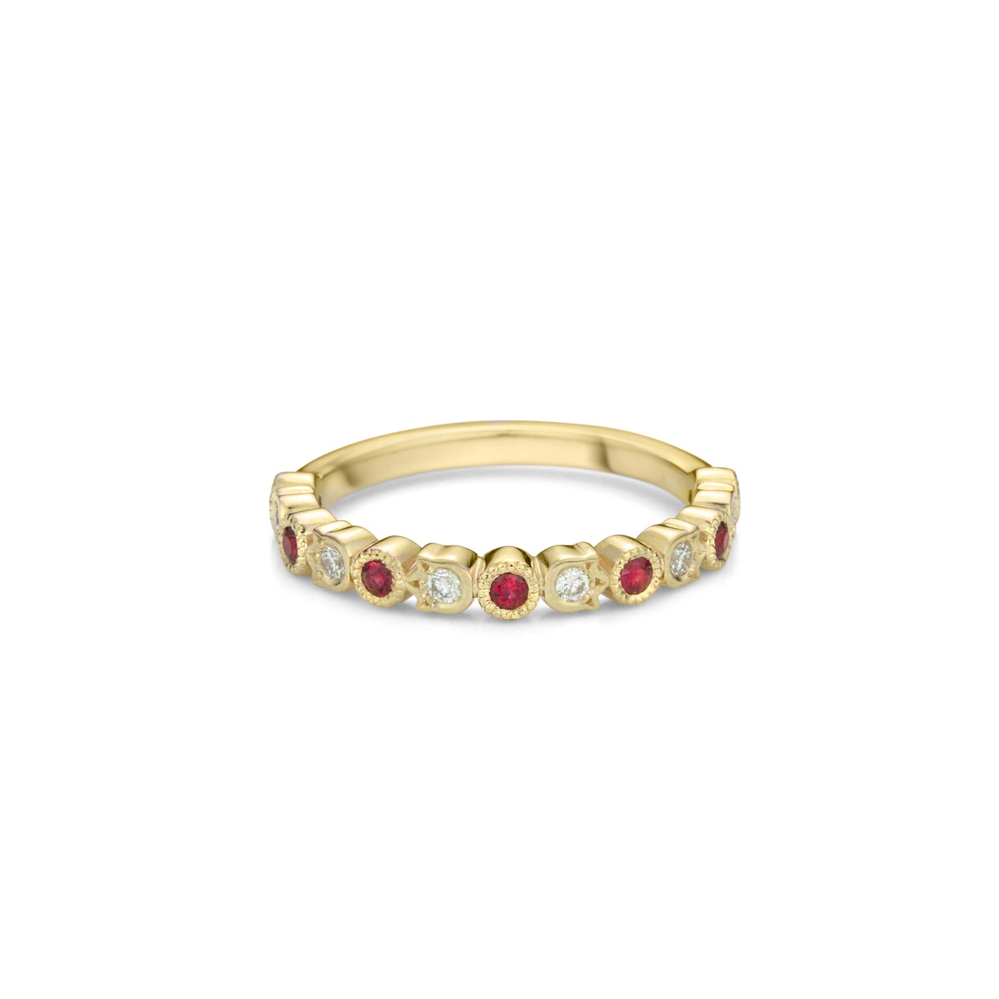 A yellow gold band style ring set half way with alternating fine rubies in round bezels with millegrain and diamonds in flower shaped bezels.
