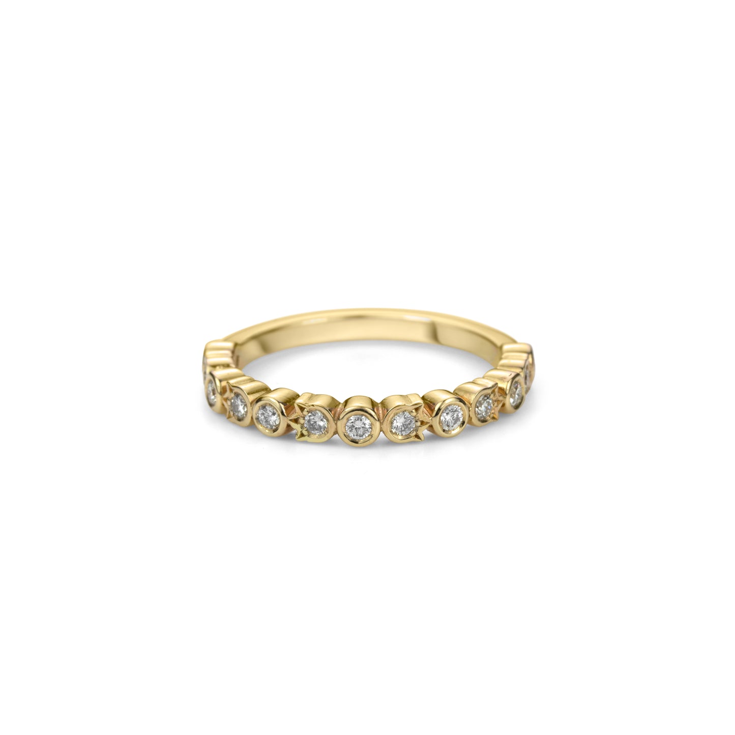 A yellow gold and diamond half eternity band ring set with diamonds in alternating round and flower shaped bezels.