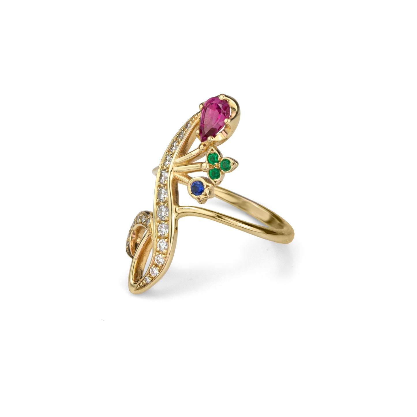 Fancy yellow gold and gemstone giardinetti style  ring with curving diamond set leaf design and multi gem pink sapphire, emerald and blue sapphire  flower accents in profile view.